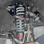 Tacoma front Eibach coilovers installed with AccuTune Offroad upper control arms