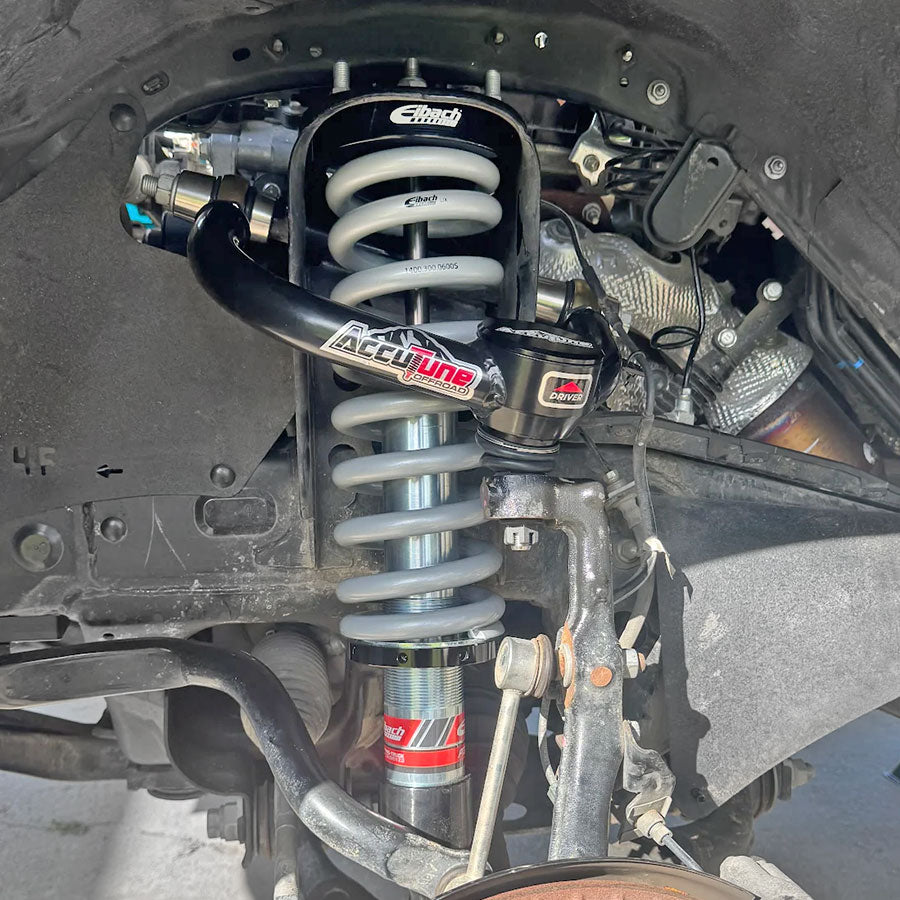 Tacoma front Eibach coilovers installed with AccuTune Offroad upper control arms