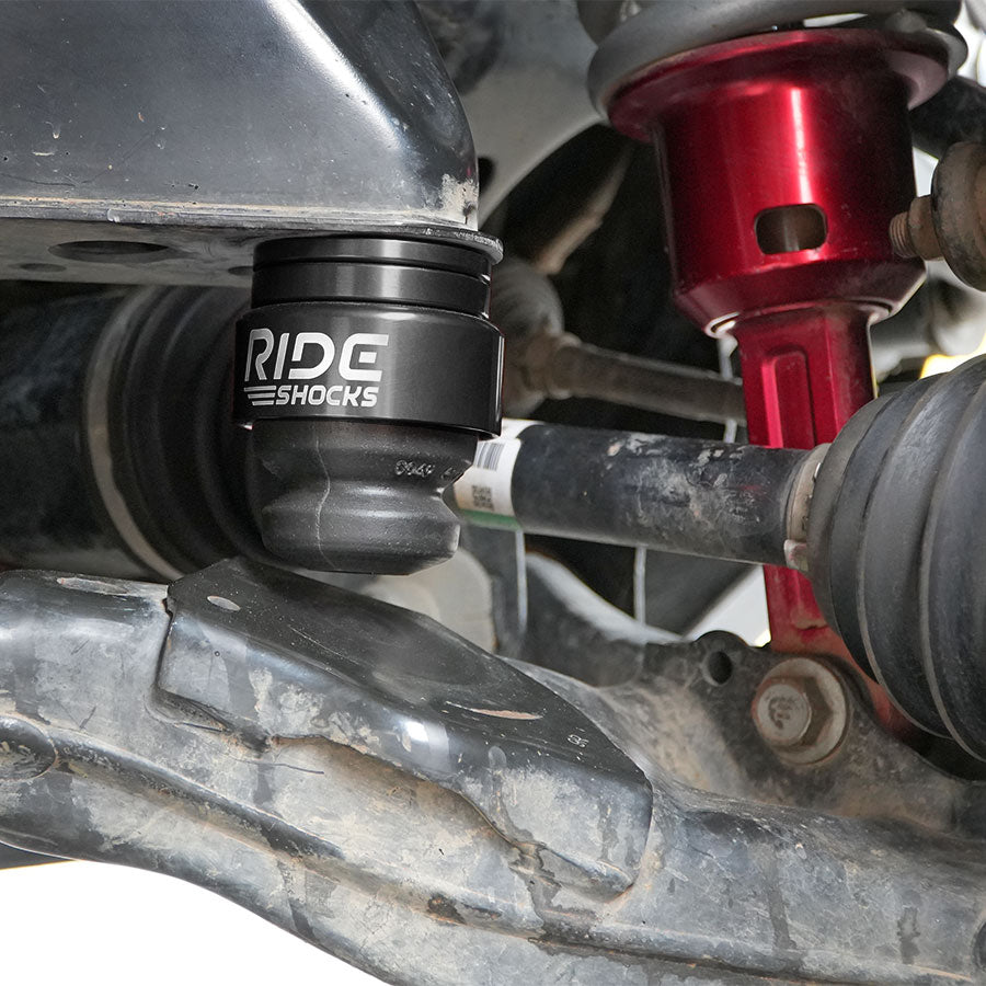 Ride Shocks Tacoma front bump stop kit installed with black aluminum cup.