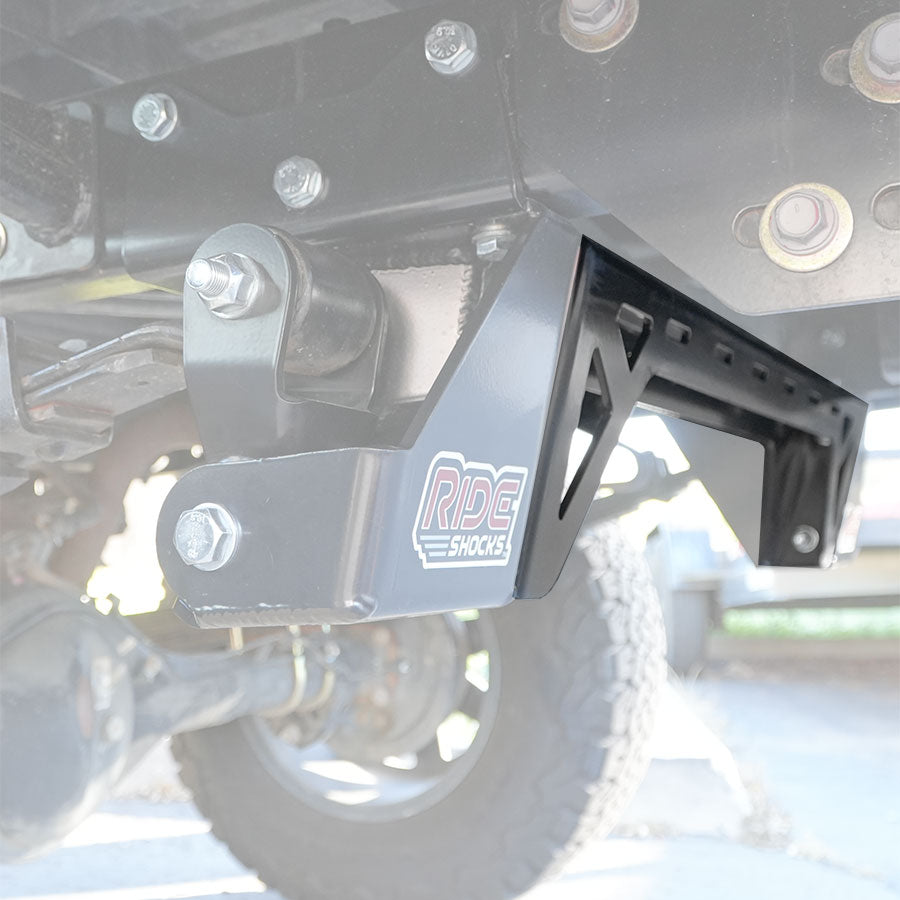 Ride Shocks Tacoma shackle hanger cross bar installed.