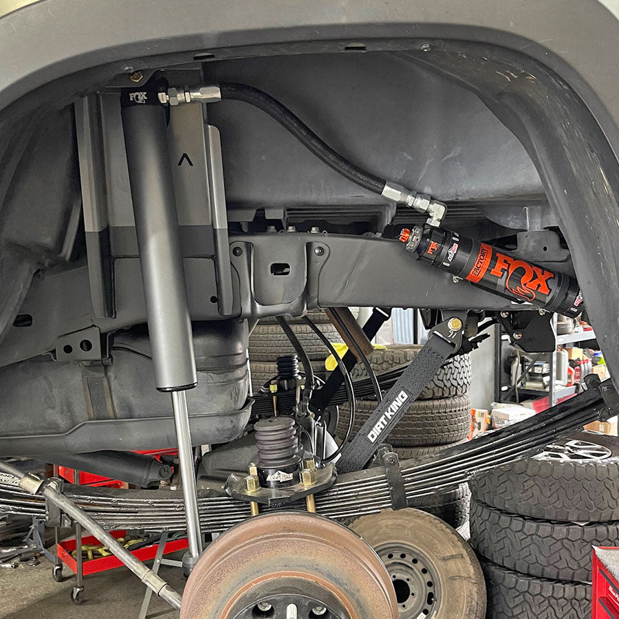 Fox 2.5 x 12" shocks with Archive Garage Shock relocation kit on 3rd Gen Toyota Tacoma.