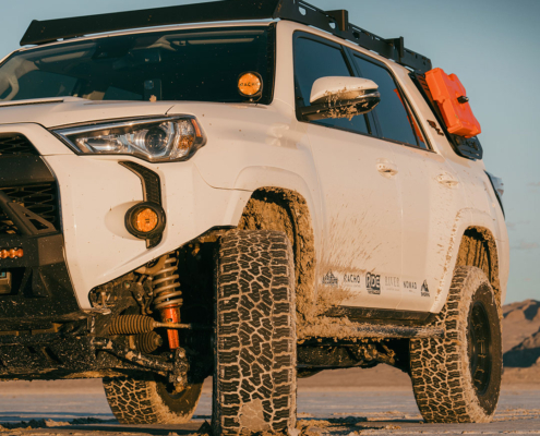 zach-asato-4runner Zach Asato white 2024 4Runner with Ride Shocks lift kit in the desert at sunset