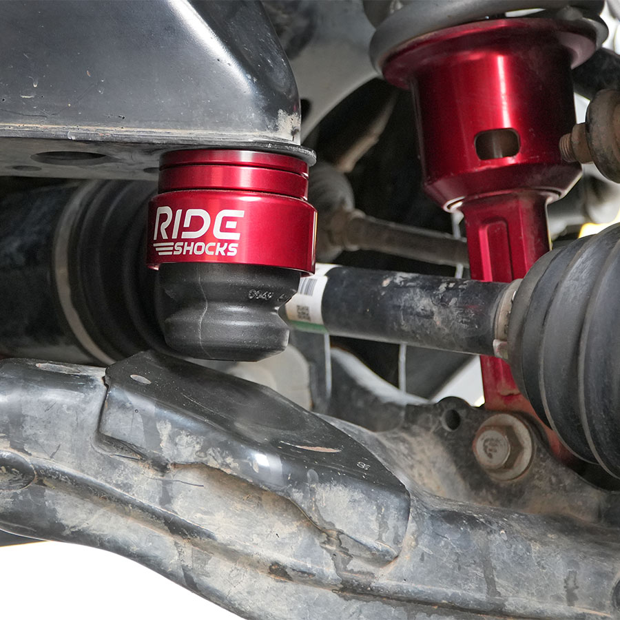 Ride Shocks Tacoma front bump stop kit installed with red aluminum cup.