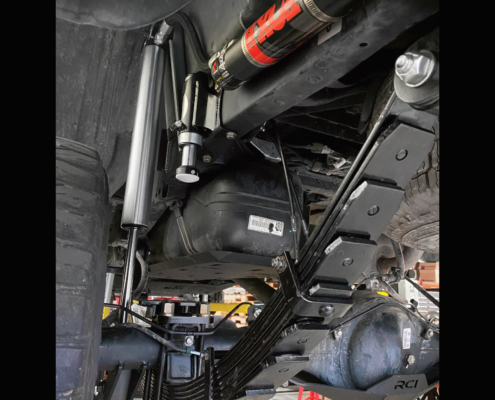 Tacoma rear shock relocation kit with Fox 2.5 x 14" shocks and 2.0 air bumps