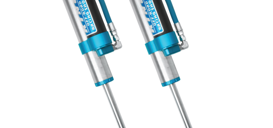 a pair of blue and silver King 2.5 Shocks with remote reservoirs from AccuTune Offroad.