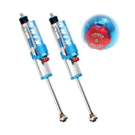 a pair of blue and silver King Shocks with remote reservoirs and compression adjusters
